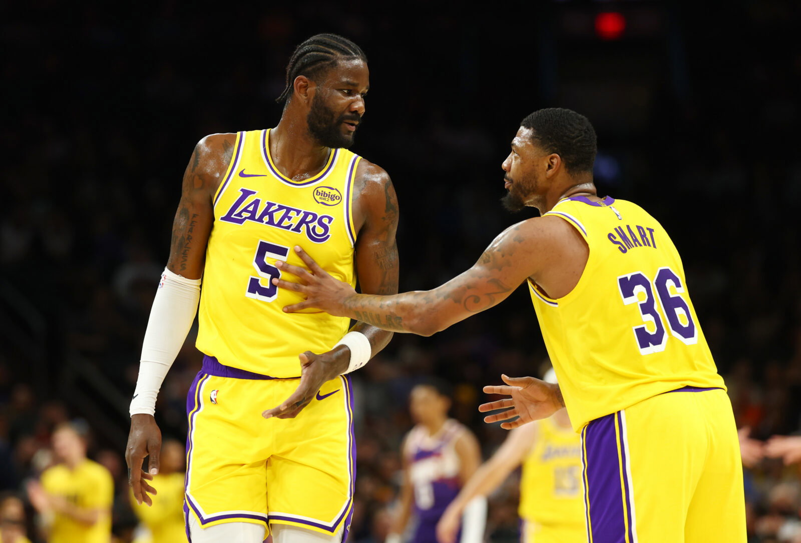 Feb 26, 2026; Phoenix, Arizona, USA; Los Angeles Lakers center Deandre Ayton (5) talks with guard Marcus Smart (36) against the Phoenix Suns at Mortgage Matchup Center. Mandatory Credit: Mark J. Rebilas-Imagn Images