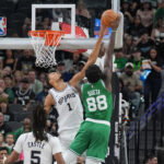Mar 10, 2026; San Antonio, Texas, USA; San Antonio Spurs forward Victor Wembanyama (1) blocks a shot against Boston Celtics center Neemias Queta (88) in the first half at Frost Bank Center. Mandatory Credit: