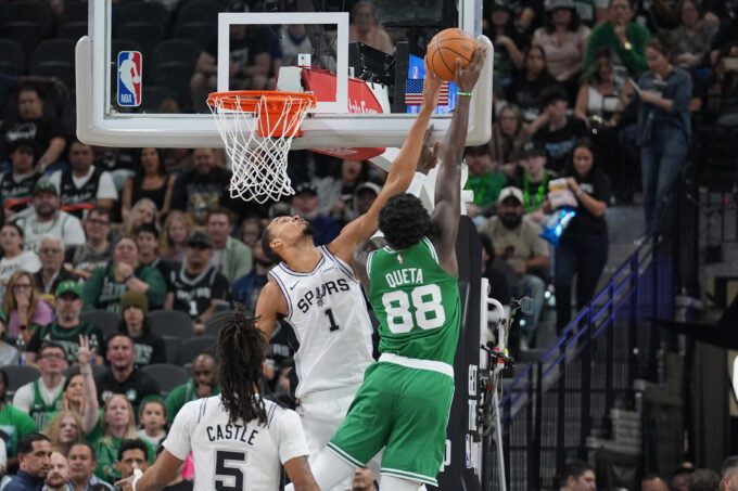 Mar 10, 2026; San Antonio, Texas, USA; San Antonio Spurs forward Victor Wembanyama (1) blocks a shot against Boston Celtics center Neemias Queta (88) in the first half at Frost Bank Center. Mandatory Credit: