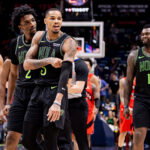 Mar 11, 2026; New Orleans, Louisiana, USA; New Orleans Pelicans guard Dejounte Murray (5) makes comments in the direction of the Toronto Raptors bench after a play against guard Jamal Shead (23) during the second half at Smoothie King Center. Mandatory Credit: Stephen Lew-Imagn Images