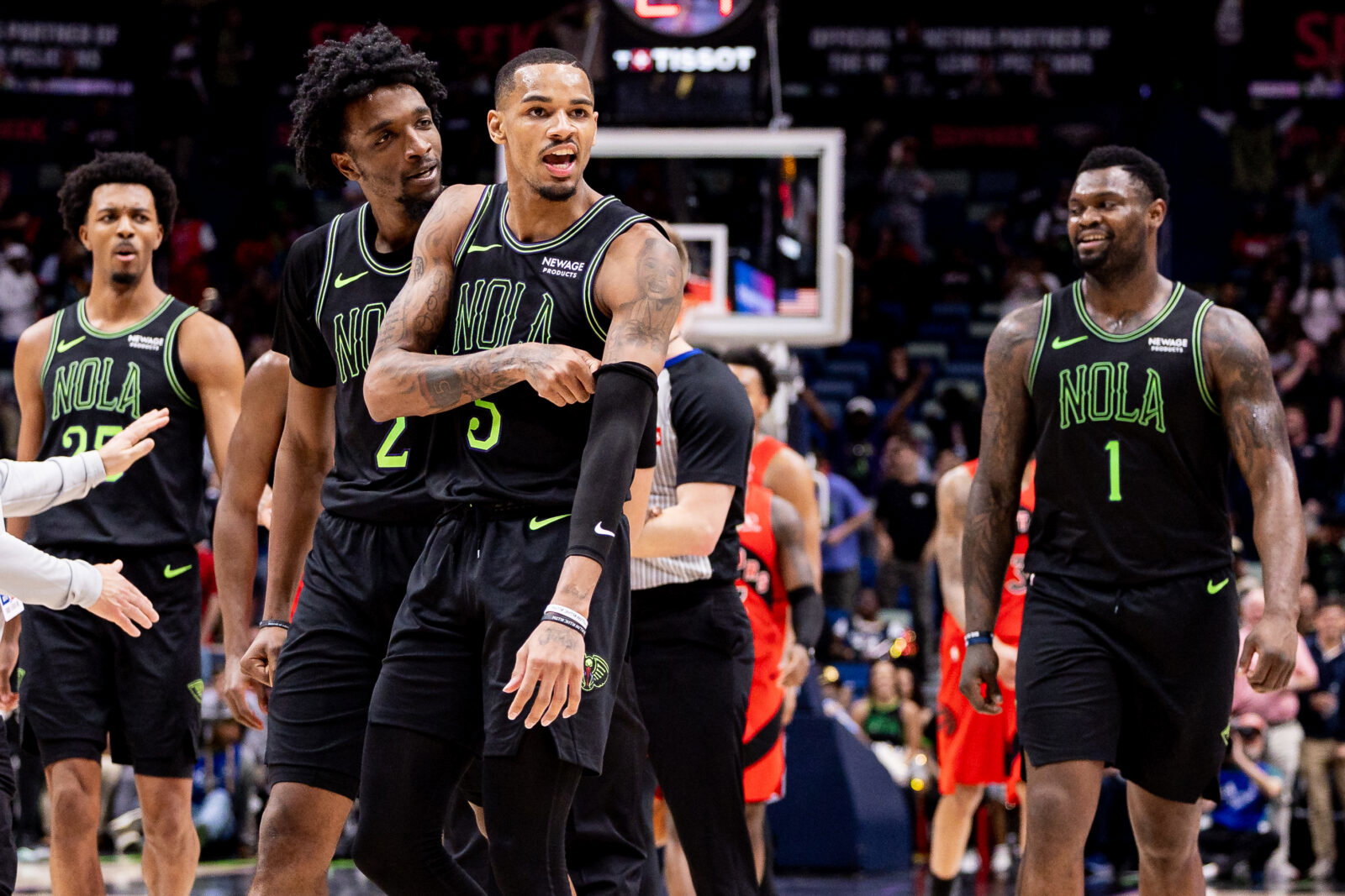 Mar 11, 2026; New Orleans, Louisiana, USA; New Orleans Pelicans guard Dejounte Murray (5) makes comments in the direction of the Toronto Raptors bench after a play against guard Jamal Shead (23) during the second half at Smoothie King Center. Mandatory Credit: Stephen Lew-Imagn Images