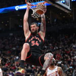 Mar 13, 2026; Toronto, Ontario, CAN; Toronto Raptors center Sandro Mamukelashvili (54) dunks the ball for a basket against the Phoenix Suns in the second half at Scotiabank Arena. Mandatory Credit: Dan Hamilton-Imagn Images