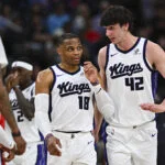 Mar 14, 2026; Inglewood, California, USA; Sacramento Kings center Maxime Raynaud (42) talks to guard Russell Westbrook (18) against the LA Clippers during the first quarter at Intuit Dome. Mandatory Credit: Jonathan Hui-Imagn Images