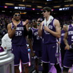 Mar 15, 2026; Sacramento, California, USA; Sacramento Kings Dylan Cardwell (32), Daeqwon Plowden (29), Maxine Raynaud (42), and Nique Clifford (5) pump up the crowd before lighting the beam after defeating the Utah Jazz at Golden 1 Center. Mandatory Credit: Dennis Lee-Imagn Images