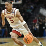 Mar 19, 2026; Portland, OR, USA; Arkansas Razorbacks guard Darius Acuff Jr. (5) drives against the Hawaii Rainbow Warriors in the second half during a first round game of the men's 2026 NCAA Tournament at Moda Center. Mandatory Credit: Craig Strobeck-Imagn Images