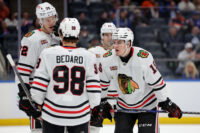 Mar 24, 2026; Elmont, New York, USA; Chicago Blackhawks center Anton Frondell (15) talks to center Connor Bedard (98) and defenseman Alex Vlasic (72) during the third period at UBS Arena. Mandatory Credit: Brad Penner-Imagn Images