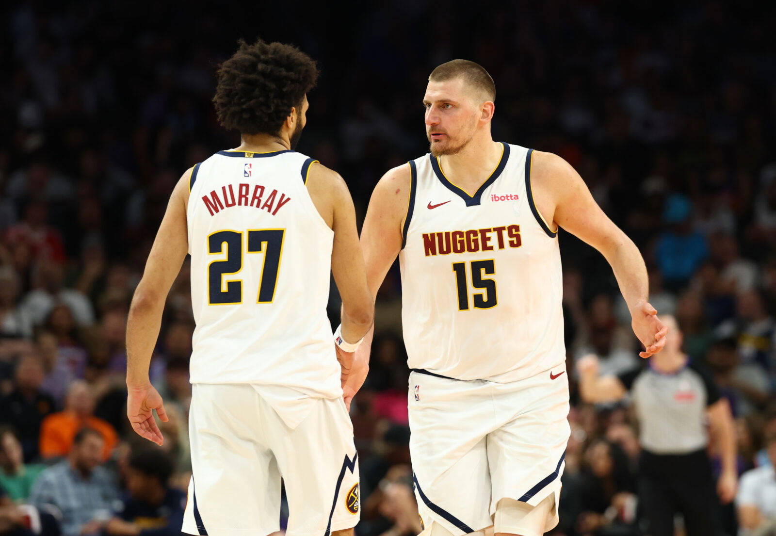 Mar 24, 2026; Phoenix, Arizona, USA; Denver Nuggets center Nikola Jokic (15) with guard Jamal Murray (27) against the Phoenix Suns in the second half at Mortgage Matchup Center. Mandatory Credit: Mark J. Rebilas-Imagn Images