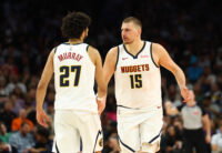 Mar 24, 2026; Phoenix, Arizona, USA; Denver Nuggets center Nikola Jokic (15) with guard Jamal Murray (27) against the Phoenix Suns in the second half at Mortgage Matchup Center. Mandatory Credit: Mark J. Rebilas-Imagn Images