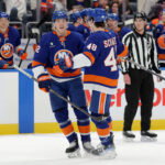 Mar 28, 2026; Elmont, New York, USA; New York Islanders right wing Simon Holmstrom (92) celebrates his goal against the Florida Panthers with defenseman Matthew Schaefer (48) during the second period at UBS Arena. Mandatory Credit: Brad Penner-Imagn Images