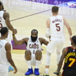 Apr 8, 2026; Cleveland, Ohio, USA; Cleveland Cavaliers guard James Harden (1) is helped to his feet by guard Donovan Mitchell (45) and guard Sam Merrill (5) in the fourth quarter against the Atlanta Hawks at Rocket Arena. Mandatory Credit: David Richard-Imagn Images