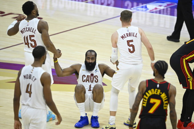 Apr 8, 2026; Cleveland, Ohio, USA; Cleveland Cavaliers guard James Harden (1) is helped to his feet by guard Donovan Mitchell (45) and guard Sam Merrill (5) in the fourth quarter against the Atlanta Hawks at Rocket Arena. Mandatory Credit: David Richard-Imagn Images