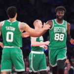 Apr 9, 2026; New York, New York, USA; Boston Celtics forward Jayson Tatum (0) high fives Boston Celtics center Neemias Queta (88) during the first half against the New York Knicks at Madison Square Garden. Mandatory Credit: