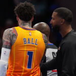 Apr 10, 2026; Charlotte, North Carolina, USA; Charlotte Hornets Head Coach Charles Lee talks with guard LaMelo Ball (1) during a time out during first quarter against the Detroit Pistons at Spectrum Center. Mandatory Credit: Jim Dedmon-Imagn Images
