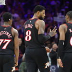 Apr 15, 2026; Philadelphia, Pennsylvania, USA; Philadelphia 76ers forward Paul George (8) talks with guard Tyrese Maxey (0) and guard Vj Edgecombe (77) during a break in action against the Orlando Magic in the third quarter of a play-in round of the 2026 NBA Playoffs at Xfinity Mobile Arena. Mandatory Credit: Bill Streicher-Imagn Images