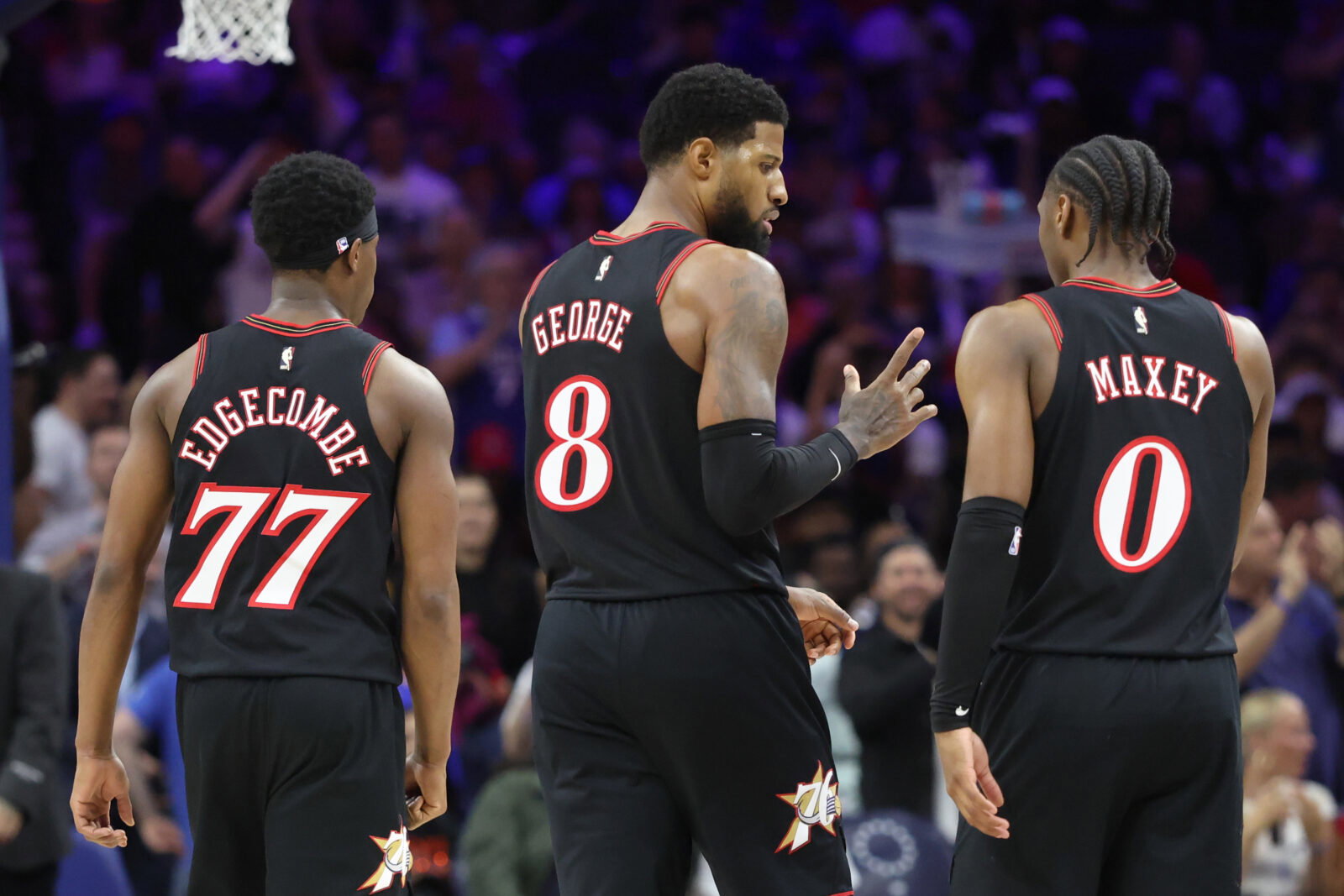 Apr 15, 2026; Philadelphia, Pennsylvania, USA; Philadelphia 76ers forward Paul George (8) talks with guard Tyrese Maxey (0) and guard Vj Edgecombe (77) during a break in action against the Orlando Magic in the third quarter of a play-in round of the 2026 NBA Playoffs at Xfinity Mobile Arena. Mandatory Credit: Bill Streicher-Imagn Images