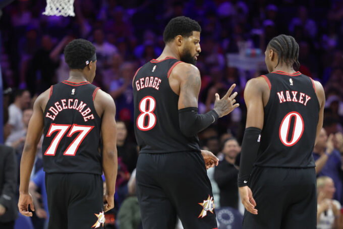 Apr 15, 2026; Philadelphia, Pennsylvania, USA; Philadelphia 76ers forward Paul George (8) talks with guard Tyrese Maxey (0) and guard Vj Edgecombe (77) during a break in action against the Orlando Magic in the third quarter of a play-in round of the 2026 NBA Playoffs at Xfinity Mobile Arena. Mandatory Credit: Bill Streicher-Imagn Images