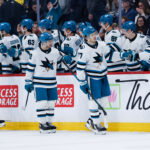 Apr 16, 2026; Winnipeg, Manitoba, CAN; San Jose Sharks forward Michael Misa (77) is congratulated by his team mates on his goal against the Winnipeg Jets during the second period at Canada Life Centre. Mandatory Credit: Terrence Lee-Imagn Images