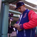 Apr 20, 2026; Boston, Massachusetts, USA; Boston Red Sox manager Alex Cora signs a baseball for a fan prior to a game against the Detroit Tigers at Fenway Park. Mandatory Credit: Bob DeChiara-Imagn Images