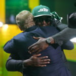 Apr 23, 2026; Pittsburgh, PA, USA; Texas Tech Red Raiders linebacker David Bailey embraces NFL commissioner Roger Goodell after he is selected by the New York Jets as the number two pick during the 2026 NFL Draft at Acrisure Stadium. Mandatory Credit: Kirby Lee-Imagn Images