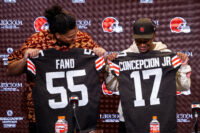 Apr 24, 2026; Berea, OH, USA; Cleveland Browns first round draft picks Spencer Fano, left, and KC Concepcion hold their new jerseys during an introductory press conference at CrossCountry Mortgage Campus.