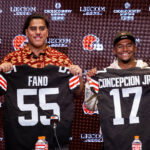 Apr 24, 2026; Berea, OH, USA; Cleveland Browns first round draft picks Spencer Fano, left, and KC Concepcion hold their new jerseys during an introductory press conference at CrossCountry Mortgage Campus. Mandatory Credit: Ken Blaze-Imagn Images