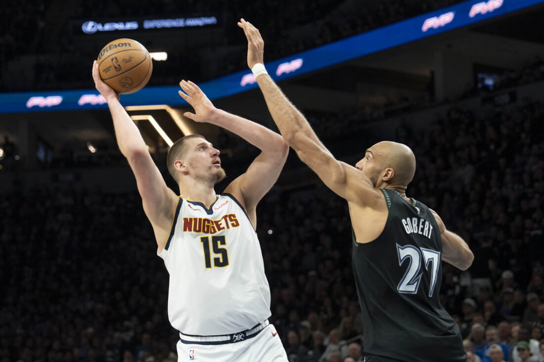 Apr 30, 2026; Minneapolis, Minnesota, USA; Denver Nuggets center Nikola Jokic (15) shoots the ball over Minnesota Timberwolves center Rudy Gobert (27) in the second half during game six of the first round of the 2026 NBA Playoffs at Target Center.