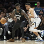 Apr 30, 2026; Minneapolis, Minnesota, USA; Minnesota Timberwolves forward Julius Randle (30) dribbles the ball as Denver Nuggets forward Spencer Jones (21) plays defense in the second half during game six of the first round of the 2026 NBA Playoffs at Target Center. Mandatory Credit: Jesse Johnson-Imagn Images