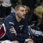Apr 30, 2026; Minneapolis, Minnesota, USA; Denver Nuggets center Nikola Jokic (15) seats on the bench before the second half begins against the Minnesota Timberwolves during game six of the first round of the 2026 NBA Playoffs at Target Center. Mandatory Credit: Jesse Johnson-Imagn Images