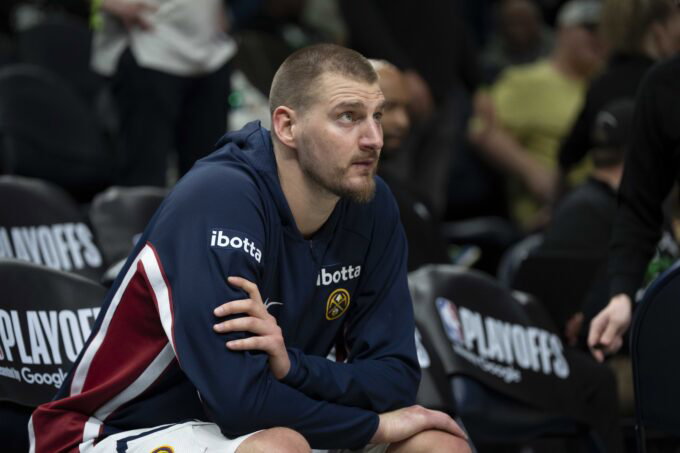 Apr 30, 2026; Minneapolis, Minnesota, USA; Denver Nuggets center Nikola Jokic (15) seats on the bench before the second half begins against the Minnesota Timberwolves during game six of the first round of the 2026 NBA Playoffs at Target Center. Mandatory Credit: Jesse Johnson-Imagn Images