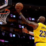 May 1, 2026; Houston, Texas, USA; Los Angeles Lakers forward Lebron James (23) makes a layup against the Houston Rockets during the fourth quarter of game six of the first round of the 2026 NBA Playoffs at Toyota Center. Mandatory Credit: Erik Williams-Imagn Images