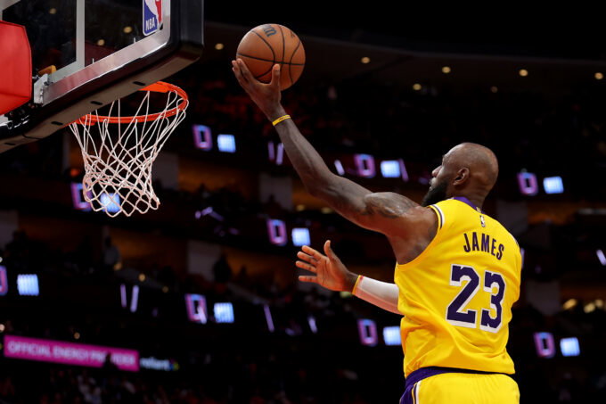 May 1, 2026; Houston, Texas, USA; Los Angeles Lakers forward Lebron James (23) makes a layup against the Houston Rockets during the fourth quarter of game six of the first round of the 2026 NBA Playoffs at Toyota Center. Mandatory Credit: Erik Williams-Imagn Images
