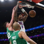 May 2, 2026; Boston, Massachusetts, USA; Philadelphia 76ers guard Kelly Oubre Jr. (9) dunks past Boston Celtics center Luka Garza (52) during the first quarter of game seven of the first round of the 2026 NBA Playoffs at TD Garden.