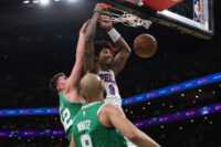May 2, 2026; Boston, Massachusetts, USA; Philadelphia 76ers guard Kelly Oubre Jr. (9) dunks past Boston Celtics center Luka Garza (52) during the first quarter of game seven of the first round of the 2026 NBA Playoffs at TD Garden.