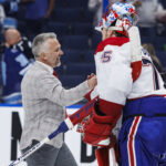 May 3, 2026; Tampa, Florida, USA; the Montreal Canadiens head coach Martin St. Louis and goalie Jakub Dobes (75) react to beating the Tampa Bay Lightning in game seven of the first round of the 2026 Stanley Cup Playoffs at Benchmark International Arena. Mandatory Credit: Morgan Tencza-Imagn Images