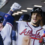 May 5, 2026; Seattle, Washington, USA; Atlanta Braves first baseman Matt Olson (28) bumps forearms with a teammate in the dugout after hitting a solo-home run against the Seattle Mariners during the ninth inning at T-Mobile Park. Mandatory Credit: Joe Nicholson-Imagn Images