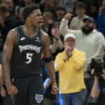 May 8, 2026; Minneapolis, Minnesota, USA; Minnesota Timberwolves guard Anthony Edwards (5) celebrates after making a three point shot as time expires in the first quarter against the San Antonio Spurs during game three of the second round of the 2026 NBA Playoffs at Target Center. Mandatory Credit: Jesse Johnson-Imagn Images