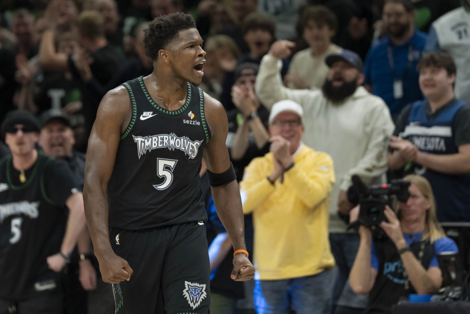 May 8, 2026; Minneapolis, Minnesota, USA; Minnesota Timberwolves guard Anthony Edwards (5) celebrates after making a three point shot as time expires in the first quarter against the San Antonio Spurs during game three of the second round of the 2026 NBA Playoffs at Target Center. Mandatory Credit: Jesse Johnson-Imagn Images