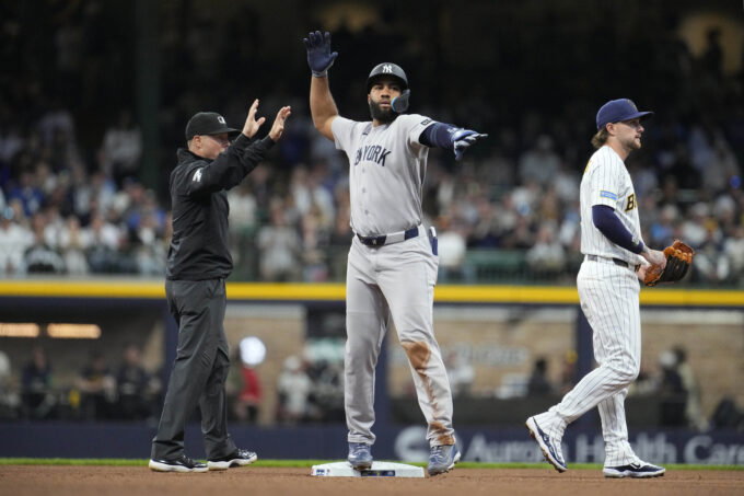 May 9, 2026; Milwaukee, Wisconsin, USA; New York Yankees third baseman Amed Rosario (14) signals back to the dug out after hitting a double against the Milwaukee Brewers in the ffourth inning at American Family Field. Mandatory Credit: Michael McLoone-Imagn Images