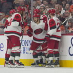 May 9, 2026; Philadelphia, Pennsylvania, USA; Carolina Hurricanes center Logan Stankoven (22) celebrates a goal with teammates against the Philadelphia Flyers in game four of the second round of the 2026 Stanely Cup Playoffs at Xfinity Mobile Arena. Mandatory Credit: James Lang-Imagn Images