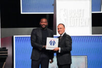 May 10, 2026; Chicago, IL, USA; Mark Tatum the NBA Deputy Commissioner and Washington Wizard (left) guard John Wall pose for photos after Wizards won the 2026 NBA Draft Lottery at Navy Pier. Mandatory Credit: David Banks-Imagn Images