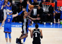 May 18, 2026; Oklahoma City, Oklahoma, USA; San Antonio Spurs guard Dylan Harper (2) shoots while defined by Oklahoma City Thunder guard Alex Caruso (9) in overtime during game one of the western conference finals for the 2026 NBA playoffs at Paycom Center. Mandatory Credit: Alonzo Adams-Imagn Images