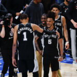 May 18, 2026; Oklahoma City, Oklahoma, USA; San Antonio Spurs center Victor Wembanyama (1) celebrates with San Antonio Spurs guard Stephon Castle (5) after defeating the Oklahoma City Thunder in double overtime against during game one of the western conference finals for the 2026 NBA playoffs at Paycom Center. Mandatory Credit: Alonzo Adams-Imagn Images
