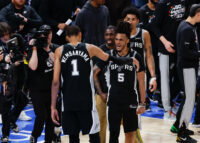 May 18, 2026; Oklahoma City, Oklahoma, USA; San Antonio Spurs center Victor Wembanyama (1) celebrates with San Antonio Spurs guard Stephon Castle (5) after defeating the Oklahoma City Thunder in double overtime against during game one of the western conference finals for the 2026 NBA playoffs at Paycom Center. Mandatory Credit: Alonzo Adams-Imagn Images