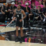 May 22, 2026; San Antonio, Texas, USA; San Antonio Spurs guard De'aaron Fox (4) reacts after an injury against the Oklahoma City Thunder in the second half during game three of the western conference finals for the 2026 NBA playoffs at Frost Bank Center. Mandatory Credit: Daniel Dunn-Imagn Images