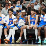 May 24, 2026; San Antonio, Texas, USA; Oklahoma City Thunder guard Shai Gilgeous-Alexander (2) exchanges words with center Chet Holmgren (7) on the bench in the fourth quarter against the San Antonio Spurs during game four of the western conference finals for the 2026 NBA playoffs at Frost Bank Center. Mandatory Credit: Daniel Dunn-Imagn Images