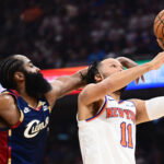 May 25, 2026; Cleveland, Ohio, USA; New York Knicks guard Jalen Brunson (11) shoots while defended by Cleveland Cavaliers guard James Harden (1) in the second quarter during game four of the eastern conference finals for the 2026 NBA playoffs at Rocket Arena. Mandatory Credit: Ken Blaze-Imagn Images