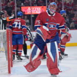 May 25, 2026; Montreal, Quebec, CAN; Montreal Canadiens goaltender Jakub Dobes (75) reacts after a collision during the second period against the Carolina Hurricanes in game three of the Eastern Conference Final of the 2026 Stanley Cup Playoffs at Bell Centre. Mandatory Credit: Eric Bolte-Imagn Images