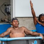 Lions running back Jamaal Williams, center, sits in an ice bath after practice during the first day of training camp July 27, 2022 in Allen Park. Credit: Junfu Han / USA TODAY NETWORK