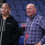 Oct 12, 2022; Ontario, California, USA; LA Clippers coach Tyronn Lue (left) talks with owner Steve Ballmer before the game against the Denver Nuggets at Toyota Arena. Mandatory Credit: Kirby Lee-USA TODAY Sports
