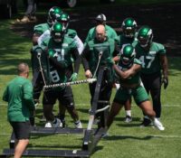 Florham Park, NJ May 31, 2023 -- The Jets defense on the tackling sled during the Jets OTA. Mandatory Credit: Chris Pedota, NorthJersey.com / USA TODAY NETWORK